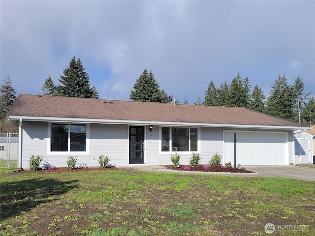 single story home with driveway, an attached garage, and a front lawn