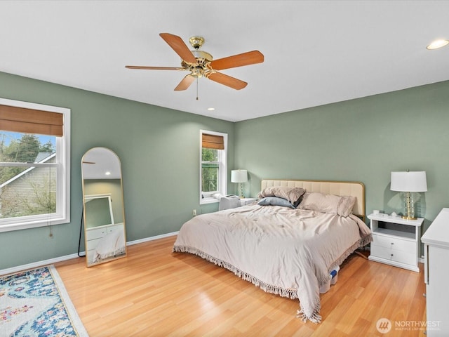 bedroom featuring recessed lighting, a ceiling fan, baseboards, and wood finished floors