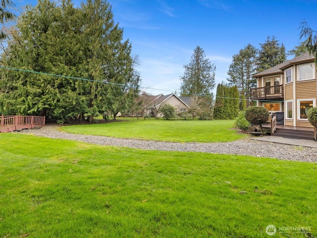 view of yard with a wooden deck