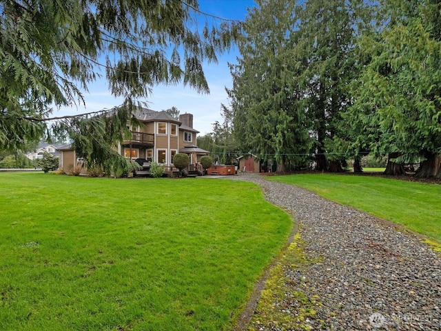 view of yard featuring a wooden deck