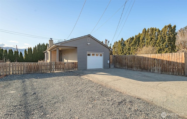 exterior space with driveway and fence