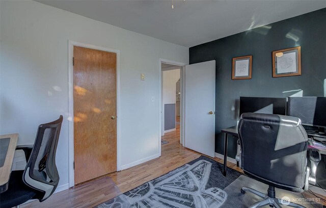 office with baseboards and wood finished floors