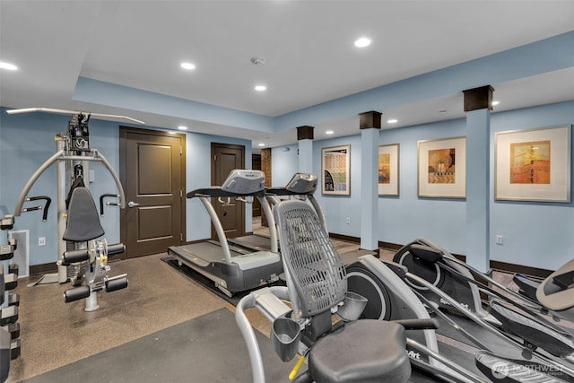 exercise room with recessed lighting and baseboards