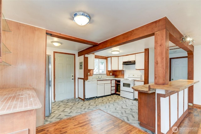 kitchen with white appliances, beam ceiling, white cabinets, under cabinet range hood, and light wood-type flooring