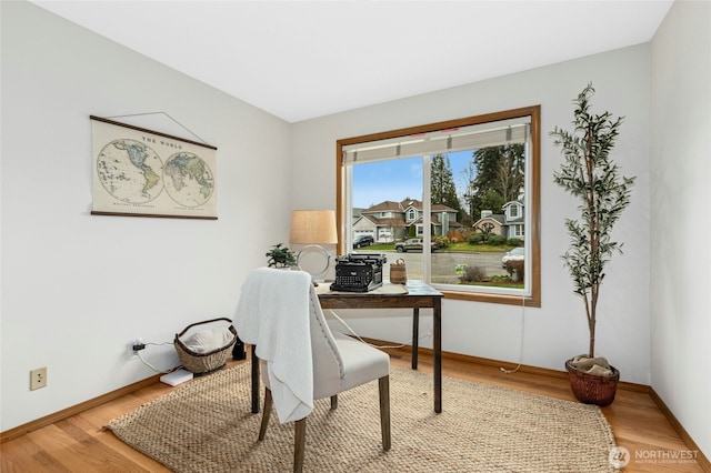 office featuring wood finished floors and baseboards