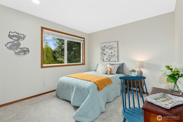 bedroom featuring baseboards and carpet flooring