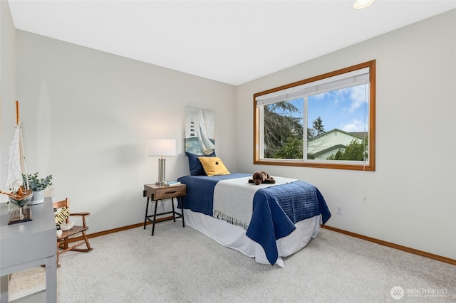 carpeted bedroom with baseboards