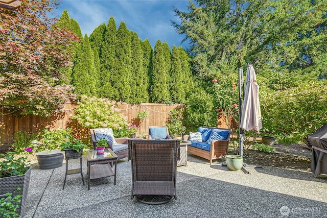 view of patio / terrace with an outdoor hangout area and a fenced backyard