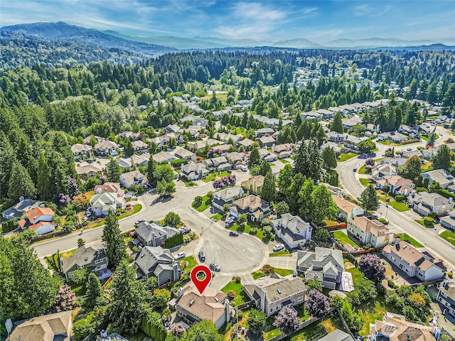 aerial view with a mountain view, a forest view, and a residential view