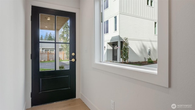 doorway to outside featuring wood finished floors