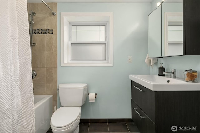 bathroom with vanity, baseboards, shower / bath combination with curtain, tile patterned floors, and toilet