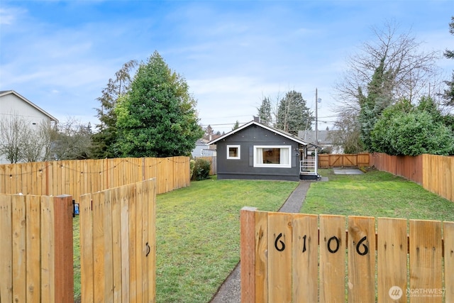 view of yard with a fenced backyard