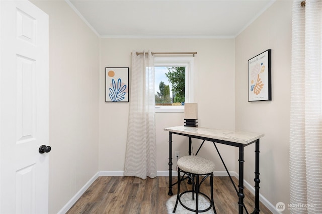 office featuring ornamental molding, baseboards, and wood finished floors