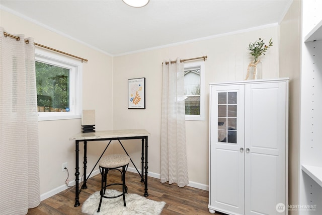 office featuring baseboards, wood finished floors, and crown molding