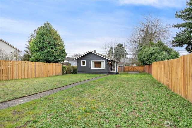 view of yard featuring a fenced backyard