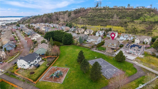 birds eye view of property with a residential view and a water view