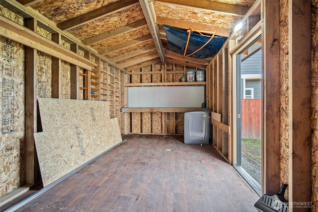 misc room with vaulted ceiling, washer / clothes dryer, and wood finished floors