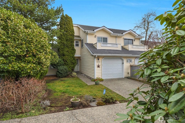 traditional home featuring driveway, roof with shingles, an attached garage, and fence