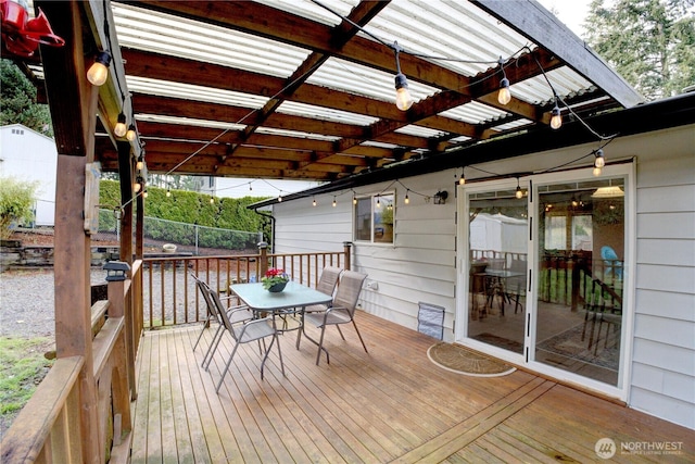 wooden terrace featuring outdoor dining area