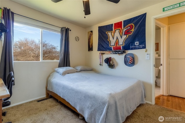 carpeted bedroom with a ceiling fan and baseboards