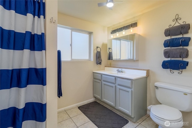 bathroom with ceiling fan, toilet, a shower with curtain, tile patterned floors, and vanity