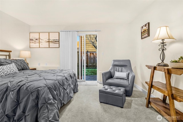 carpeted bedroom with baseboards and access to outside