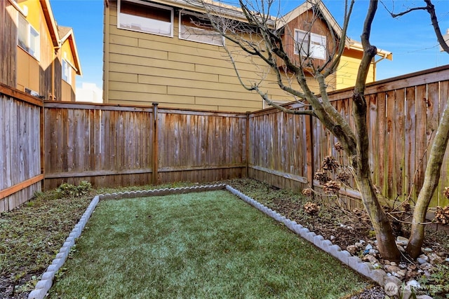 view of yard featuring a fenced backyard