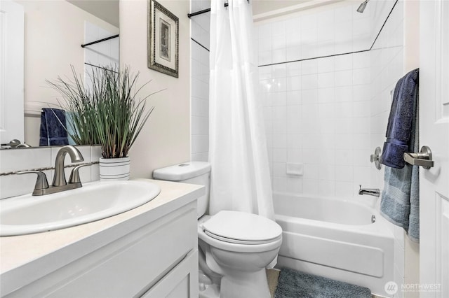 full bath featuring vanity, toilet, and shower / tub combo with curtain