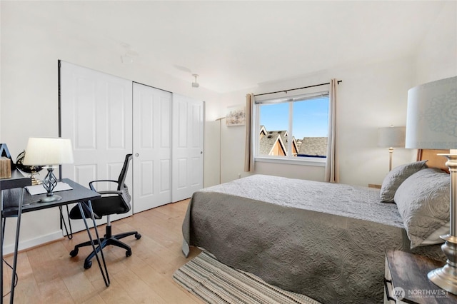 bedroom featuring wood finished floors and a closet