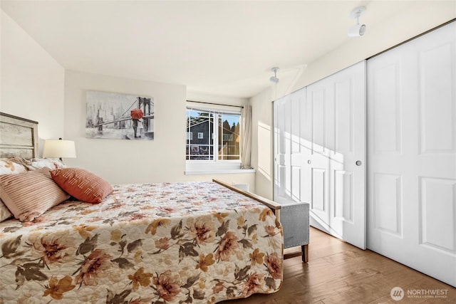 bedroom featuring a closet and wood finished floors