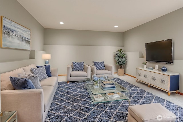 carpeted living room featuring recessed lighting and baseboards