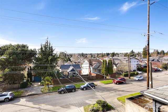 exterior space with a residential view, curbs, and sidewalks