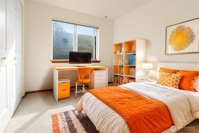 carpeted bedroom with baseboards