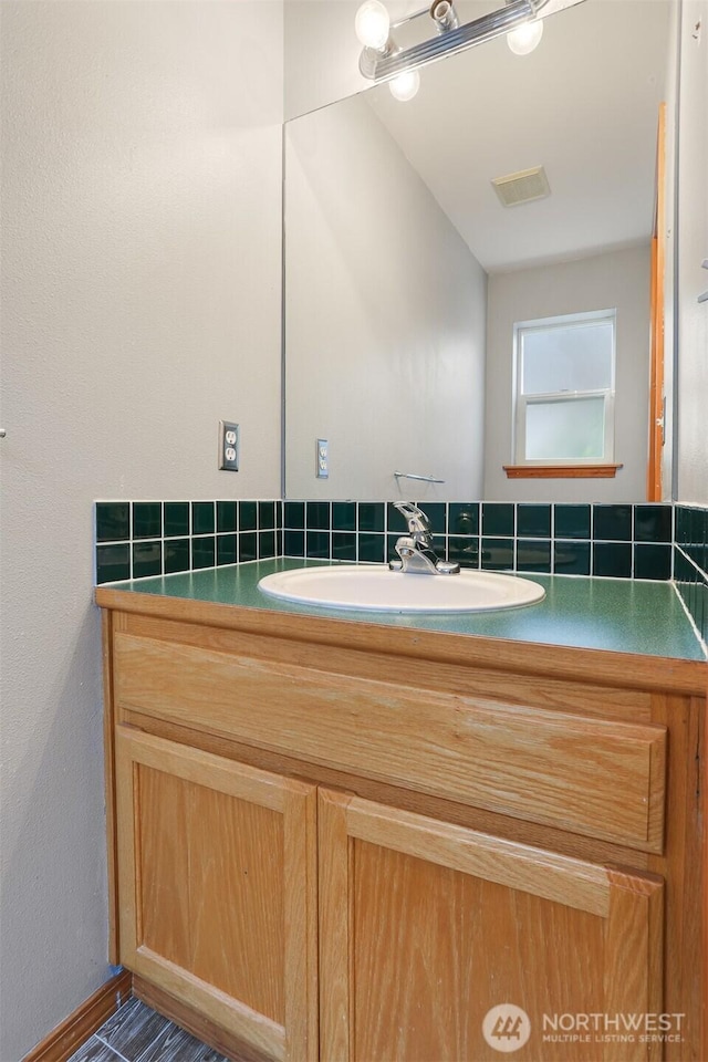 bathroom featuring visible vents and vanity