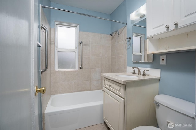 full bath with toilet, vanity, and shower / tub combination