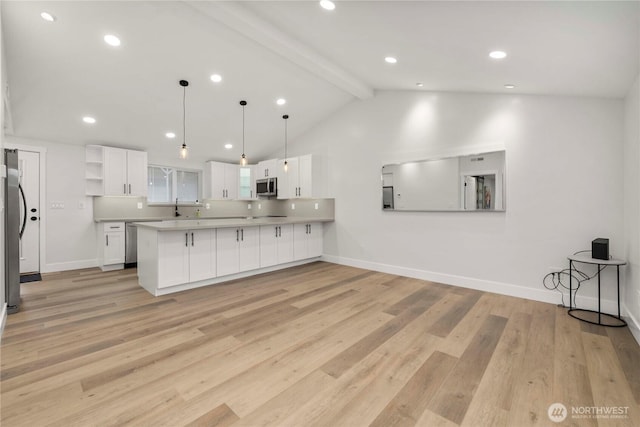 kitchen featuring white cabinetry, a peninsula, open shelves, and stainless steel appliances