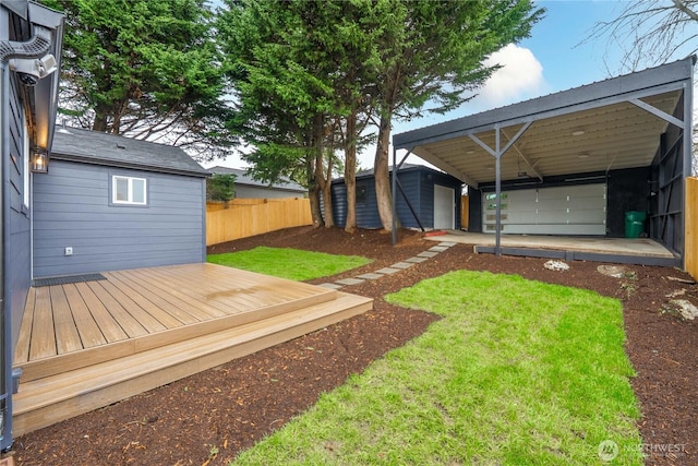 view of yard with a deck and fence