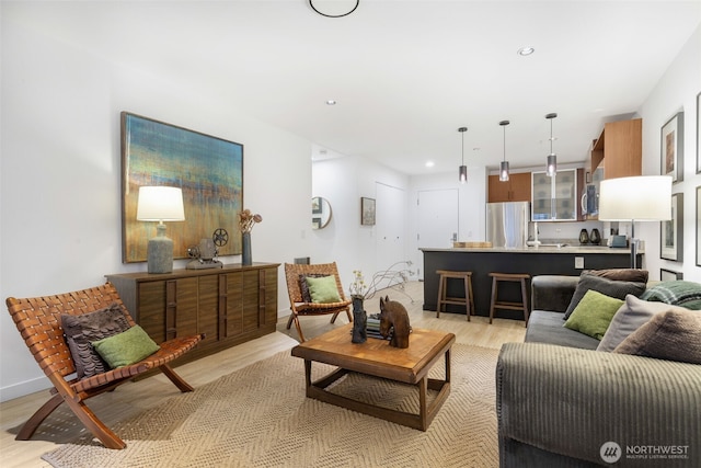 living room featuring recessed lighting and light wood-style floors