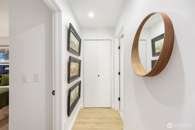 hallway with recessed lighting and light wood-style floors