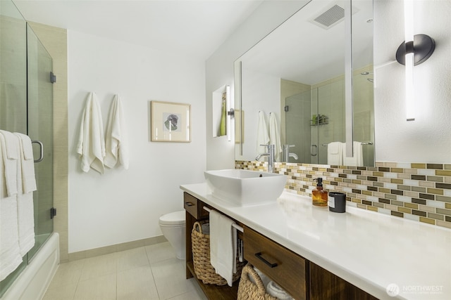 bathroom with tasteful backsplash, visible vents, tile patterned flooring, toilet, and vanity