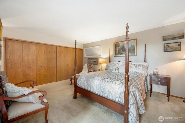 bedroom featuring light carpet