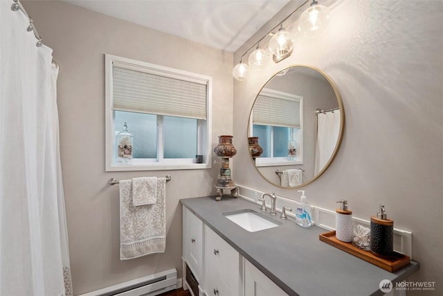 full bathroom with vanity and a baseboard radiator