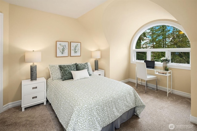 carpeted bedroom featuring baseboards