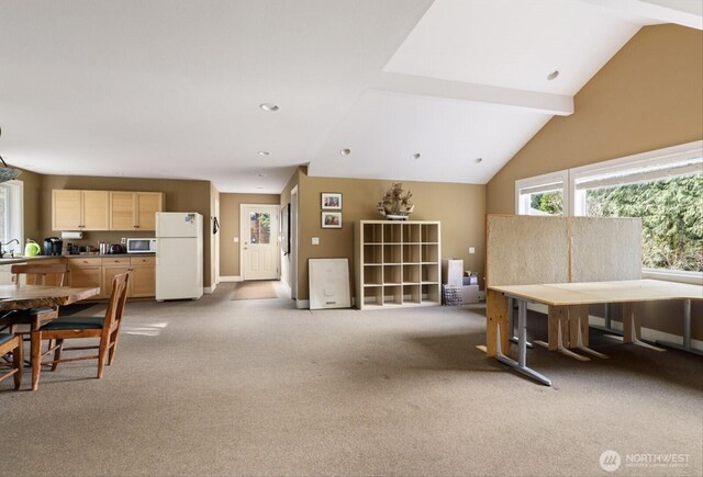 interior space with lofted ceiling with beams and carpet