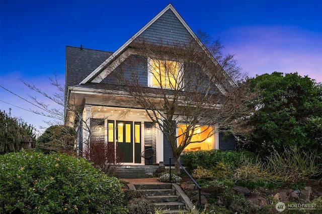 view of front of property with roof with shingles