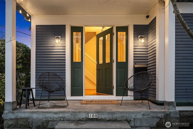 doorway to property with covered porch