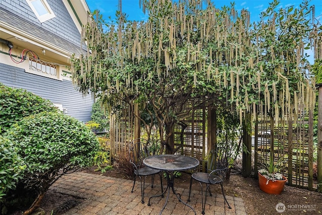 view of patio / terrace featuring fence