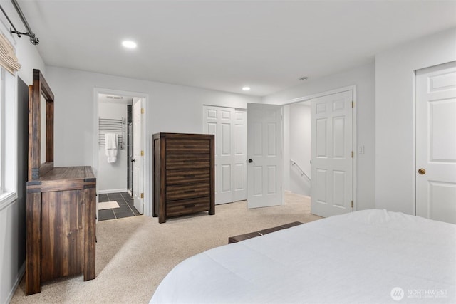 bedroom with carpet flooring, recessed lighting, and ensuite bathroom