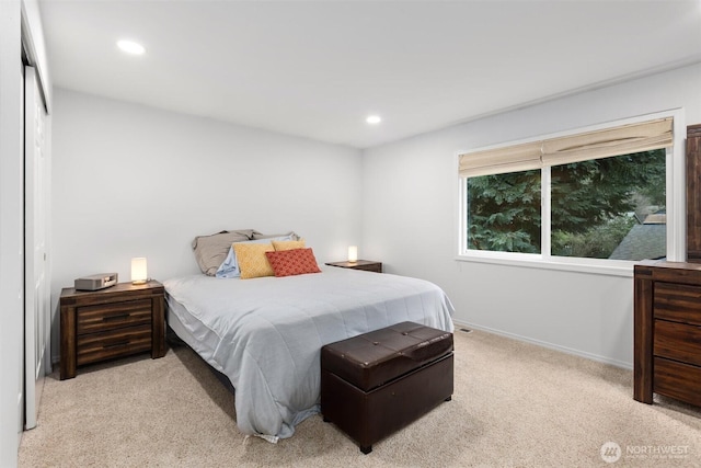 bedroom featuring recessed lighting, baseboards, and light colored carpet