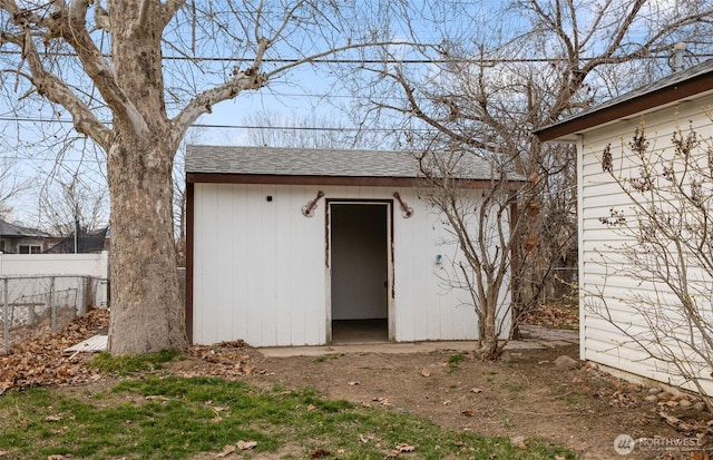 view of shed with fence